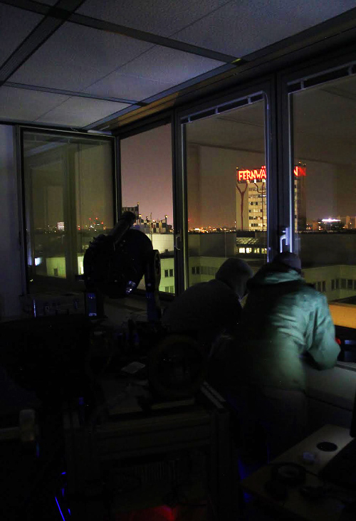 Members of the cosmic Bell test team calibrating the telescope used to choose the settings of one of their two detectors located in far-apart buildings in Vienna.