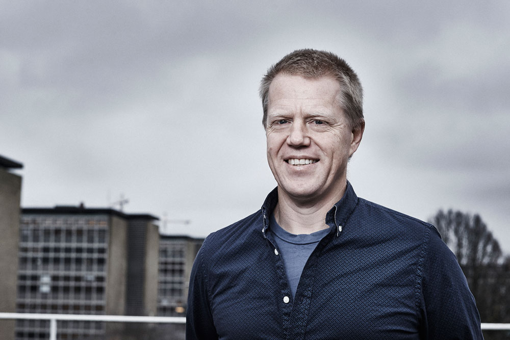 Mikkel Thorup wearing a blue shirt outside on a cloudy day