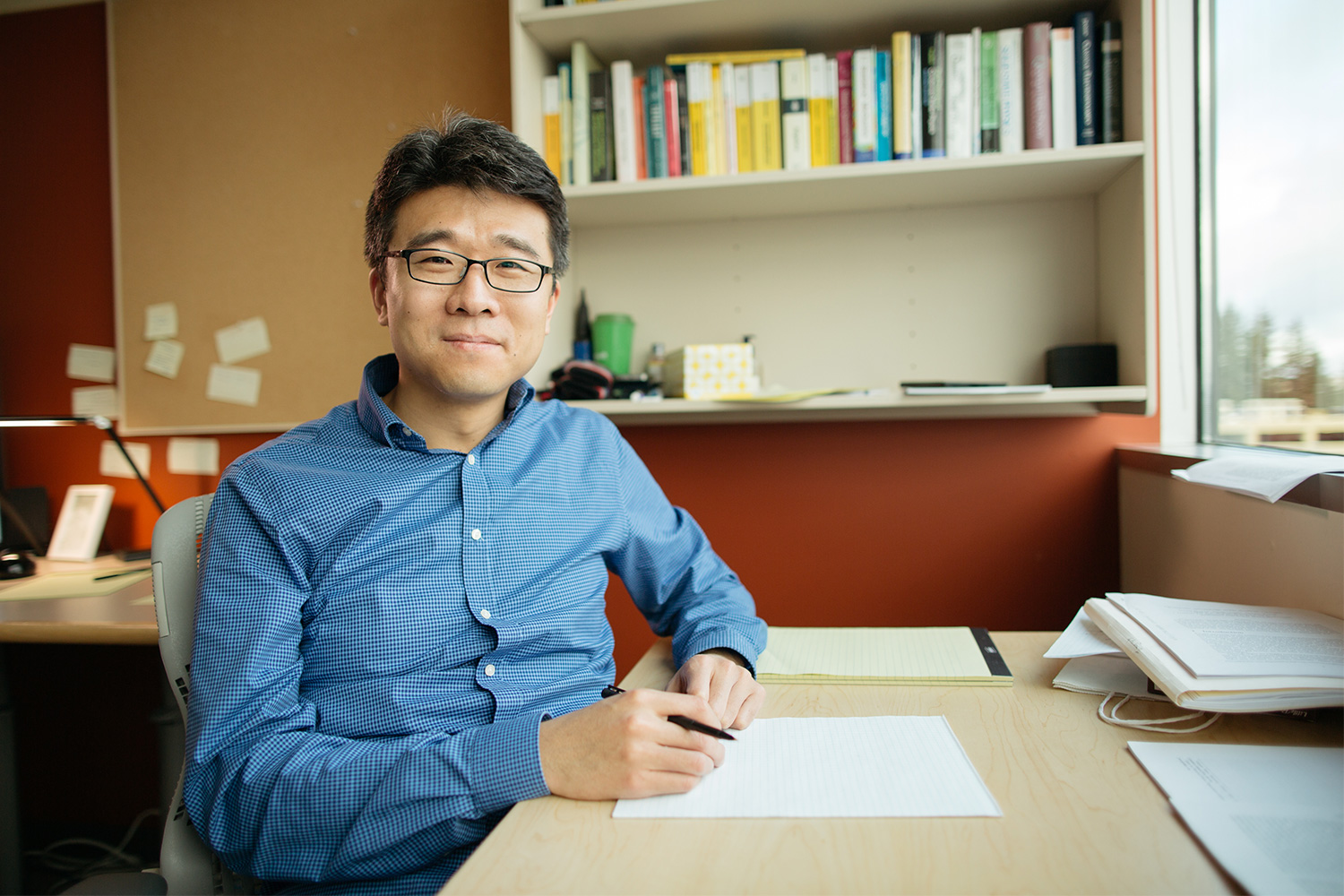 Photo of Jeongwan Haah sitting at desk