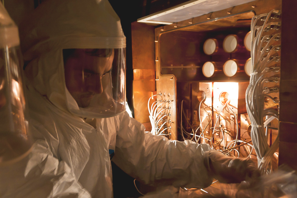 Photo of a technician working on detectors for the DAMA/LIBRA project.