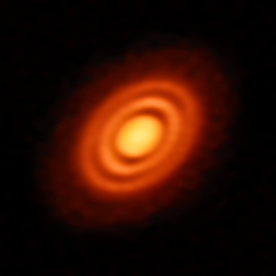 Disc of rotating, leftover material surrounding the young star HD 163296.