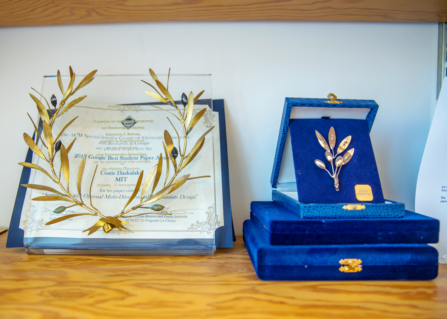 Photo of two awards on a shelf.