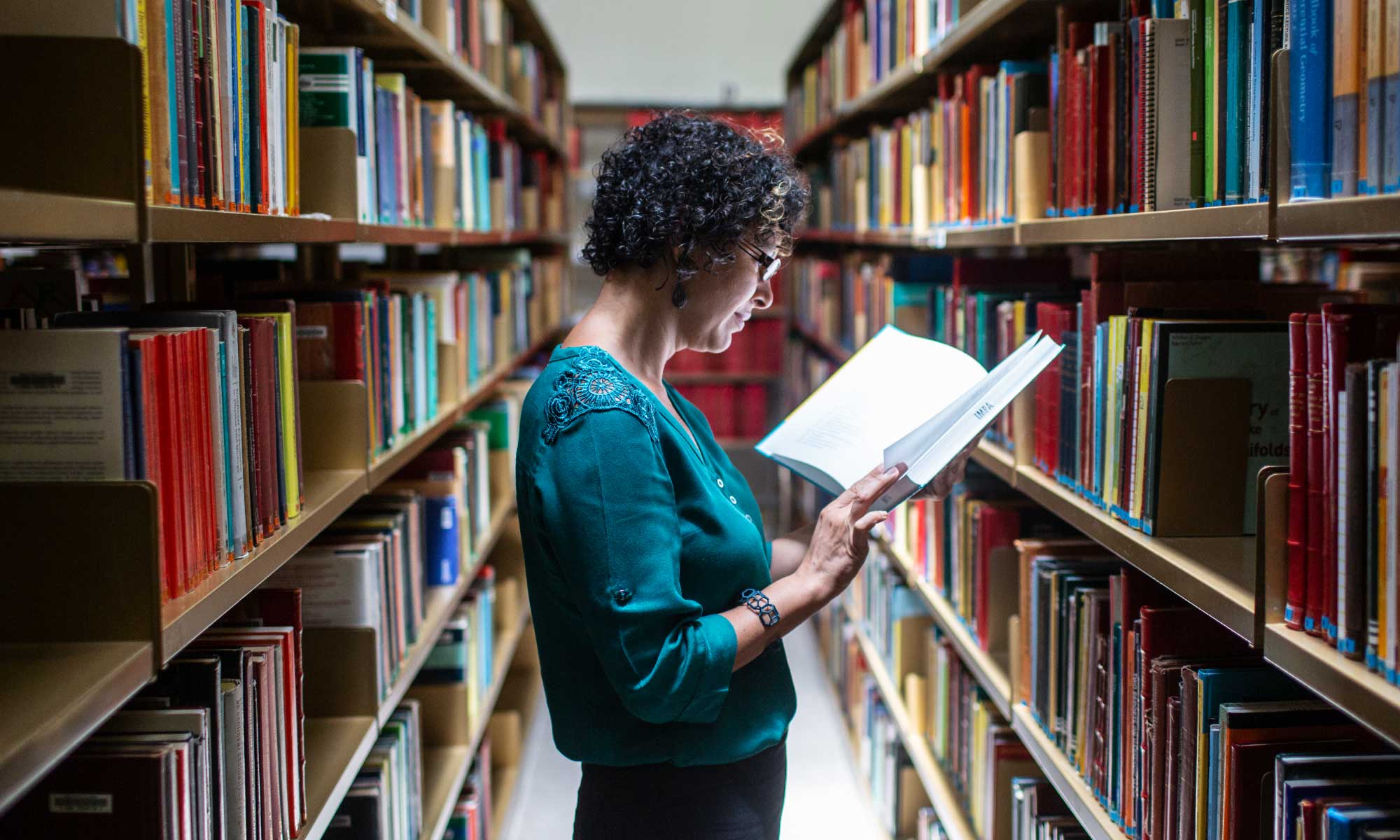 Carolina Araujo in the library at IMPA