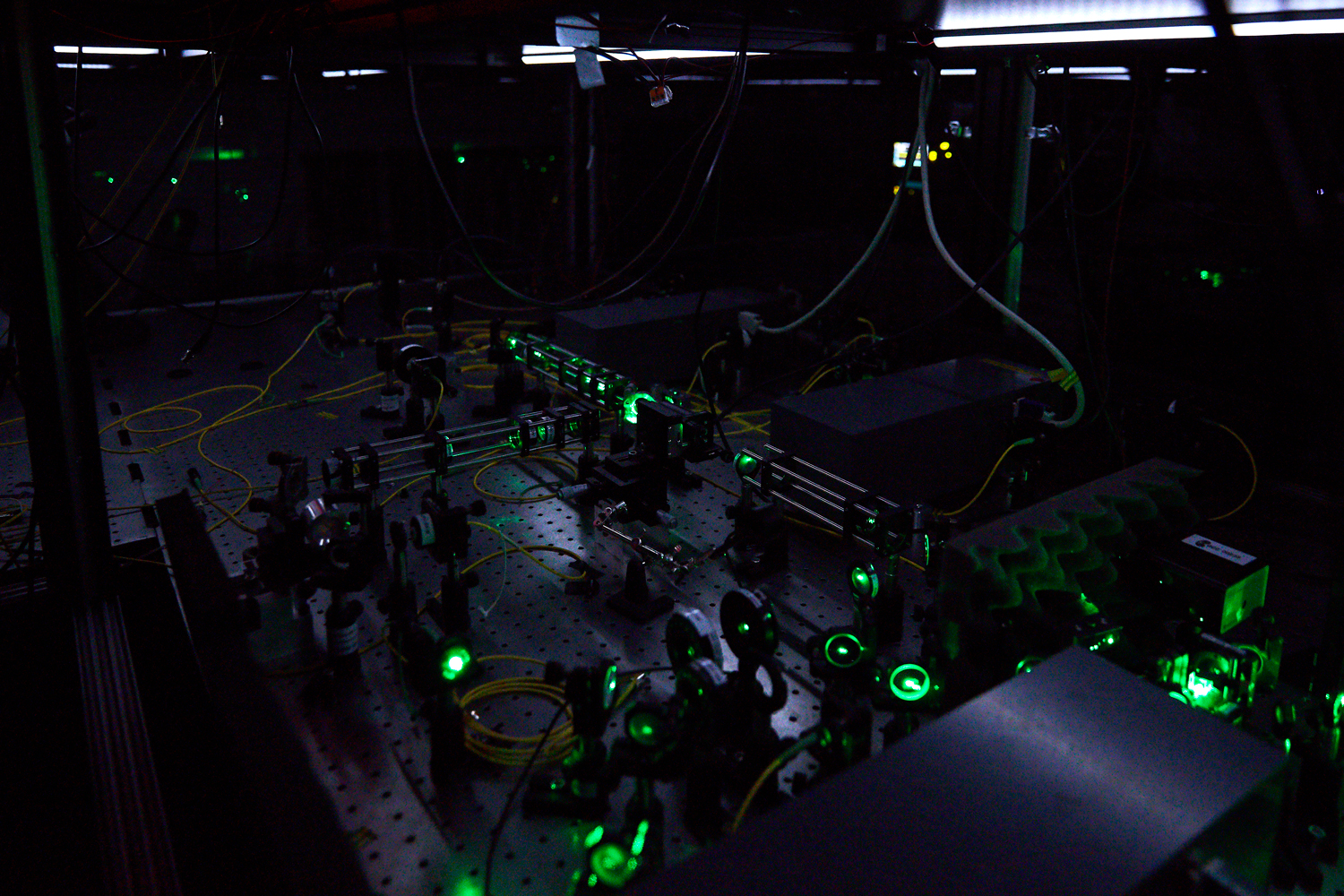 Equipment and optical tables in a laboratory at Delft University of Technology that houses a special crystal capable of storing quantum memory and serving as a network node for long-distance quantum communication.