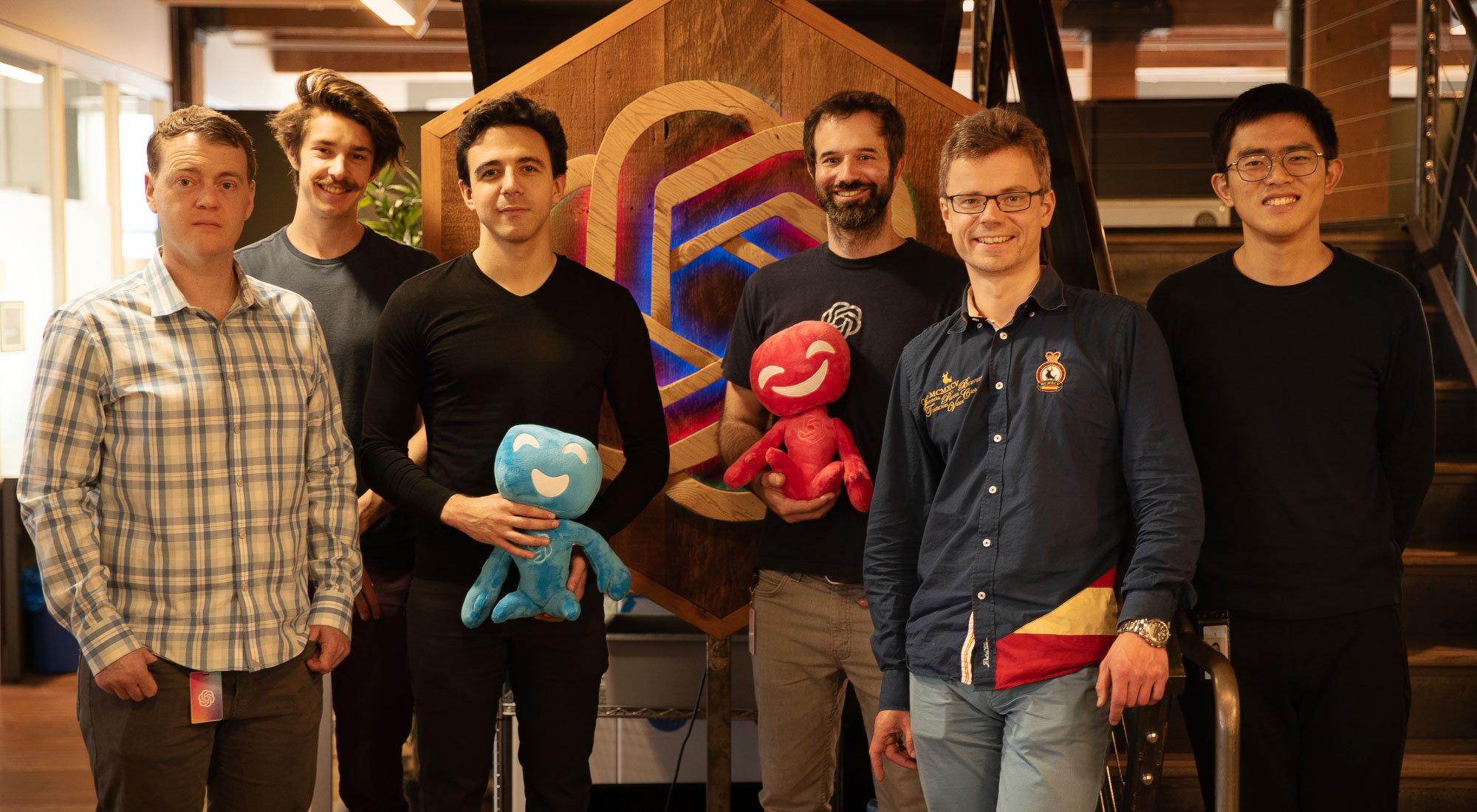 Photo showing the programmers of the OpenAI team