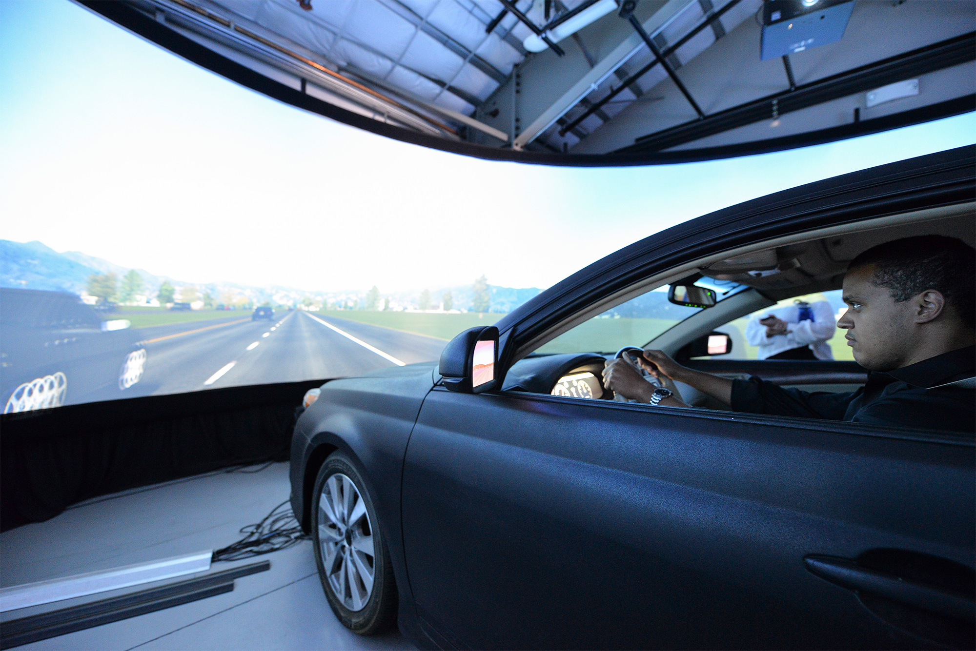 A driver uses a driving simulator at Stanford University’s Cyber and Artificial Intelligence Boot Camp for Congressional Staffers.