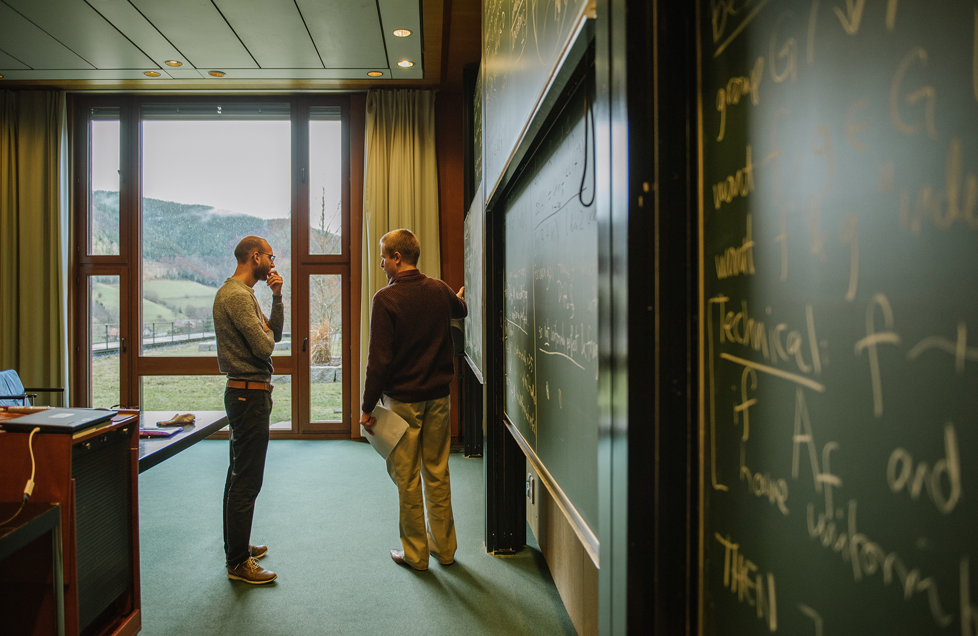 Photo of Markus Land asking Richard Webb a question after a talk