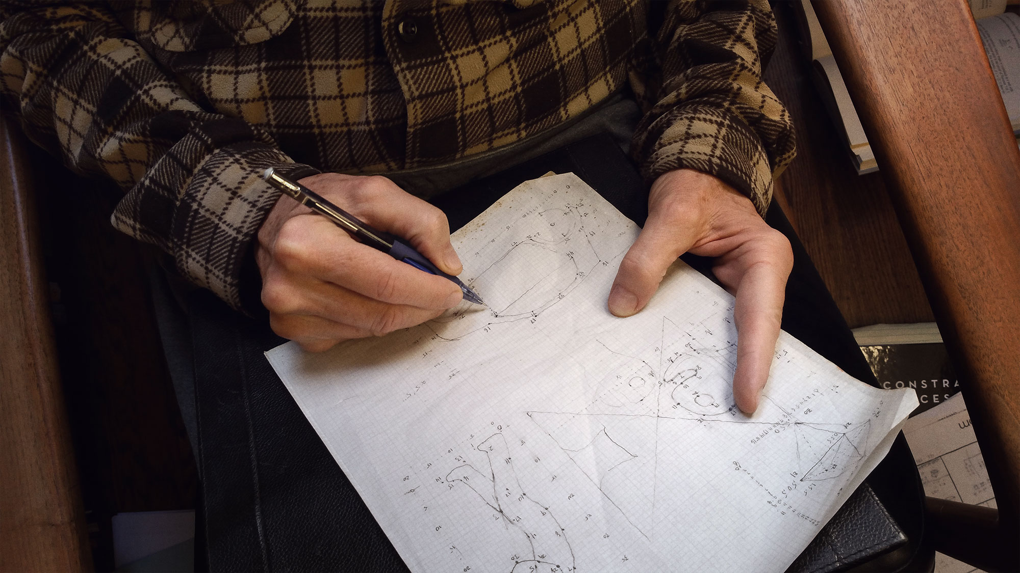 Photo of Donald Knuth drawing diagrams by hand, working on The Art of Computer Programming