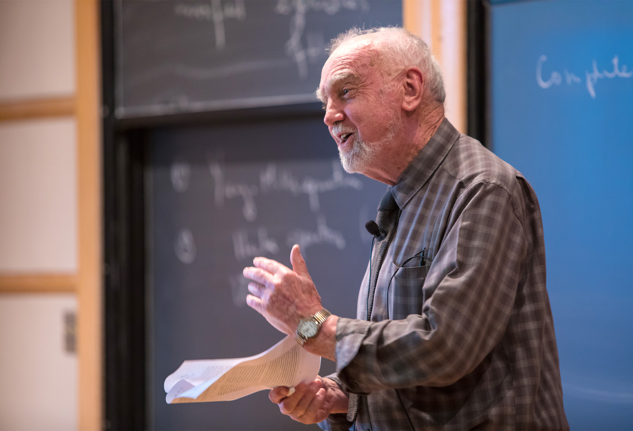 A photograph of the mathematician Robert Langlands giving a talk at the Institue for Advanced Study in 2016.