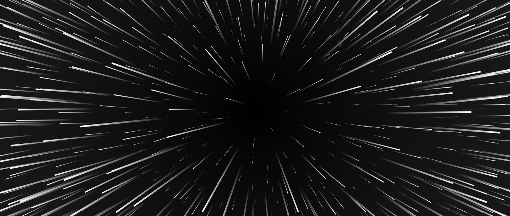 An image of space with lines emanating from a central point, as if the viewer is traveling at warp speed.