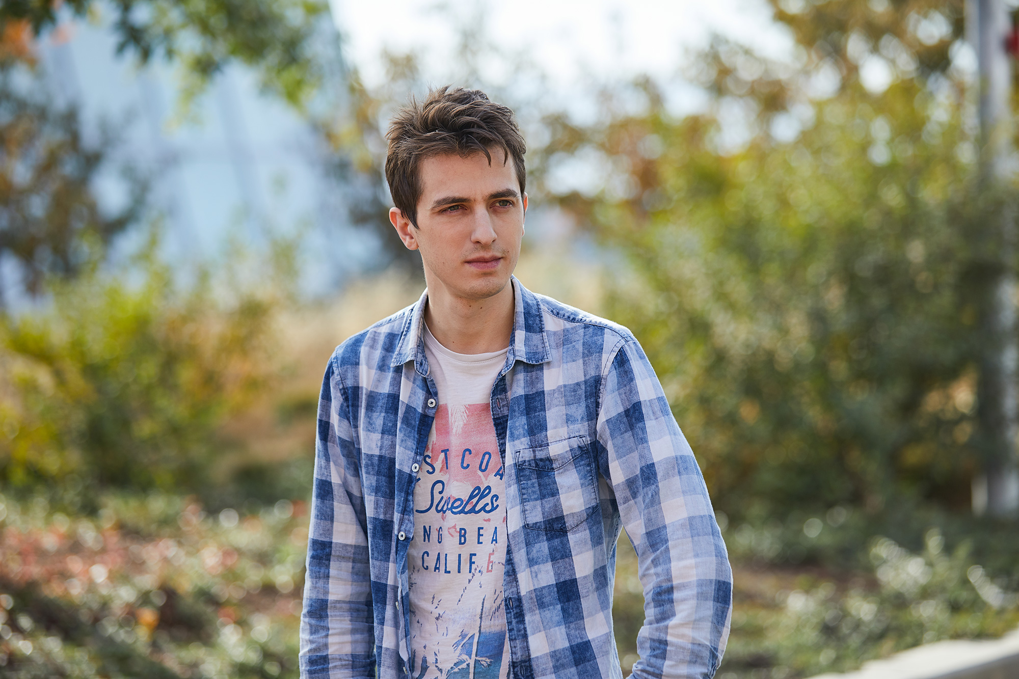 Two portraits of Facebook AI researchers François Charton and Guillaume Lample, each in an outdoor setting