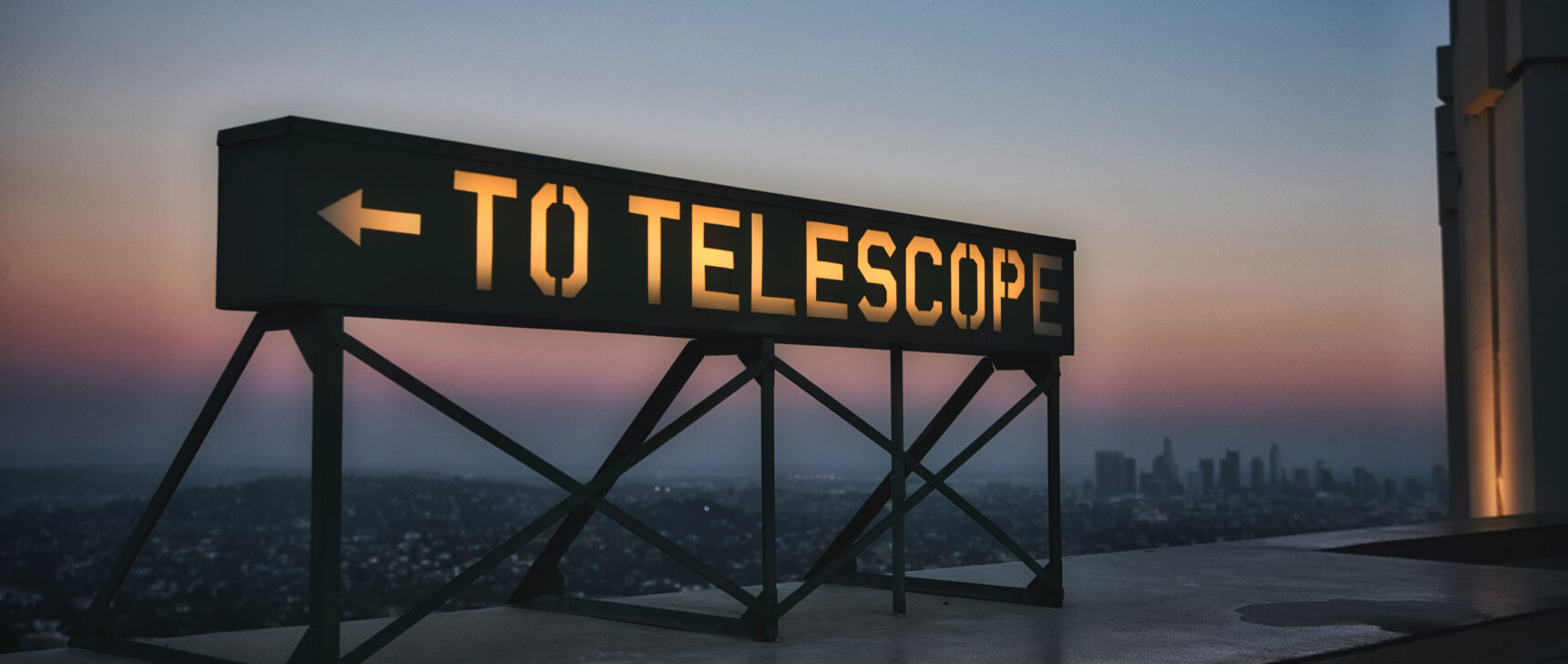 Photo of a sign reading “To Telescope” near Griffith Observatory in Los Angeles.