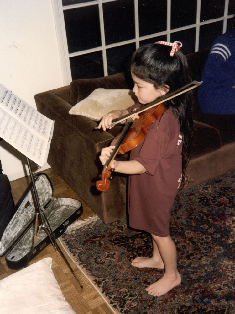 A diptych. On left, Lauren Williams standing and playing the violin in front of sheet music. On the right, Williams playing the violin as a child.