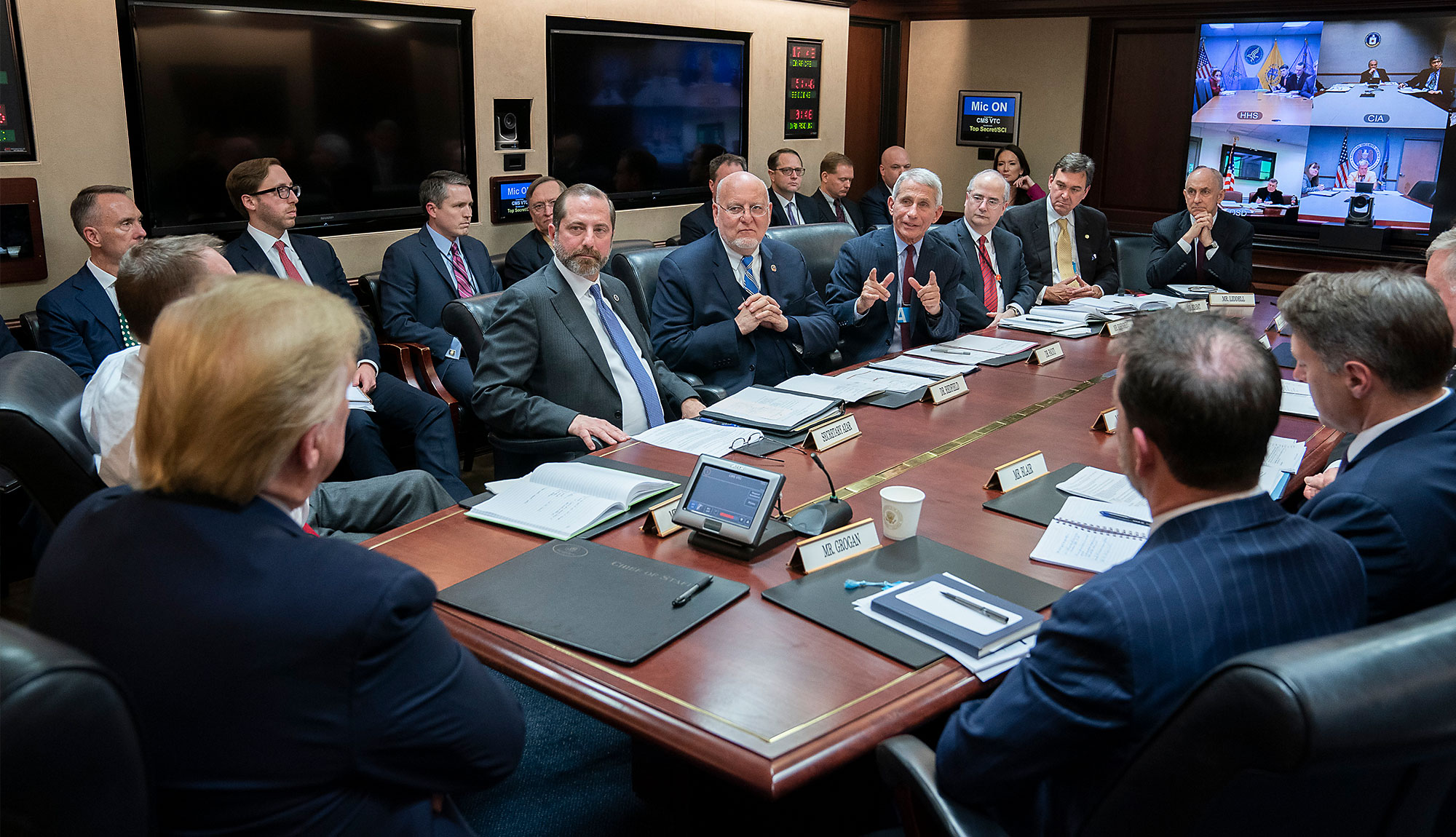 Photo of President Trump being briefed about COVID-19.