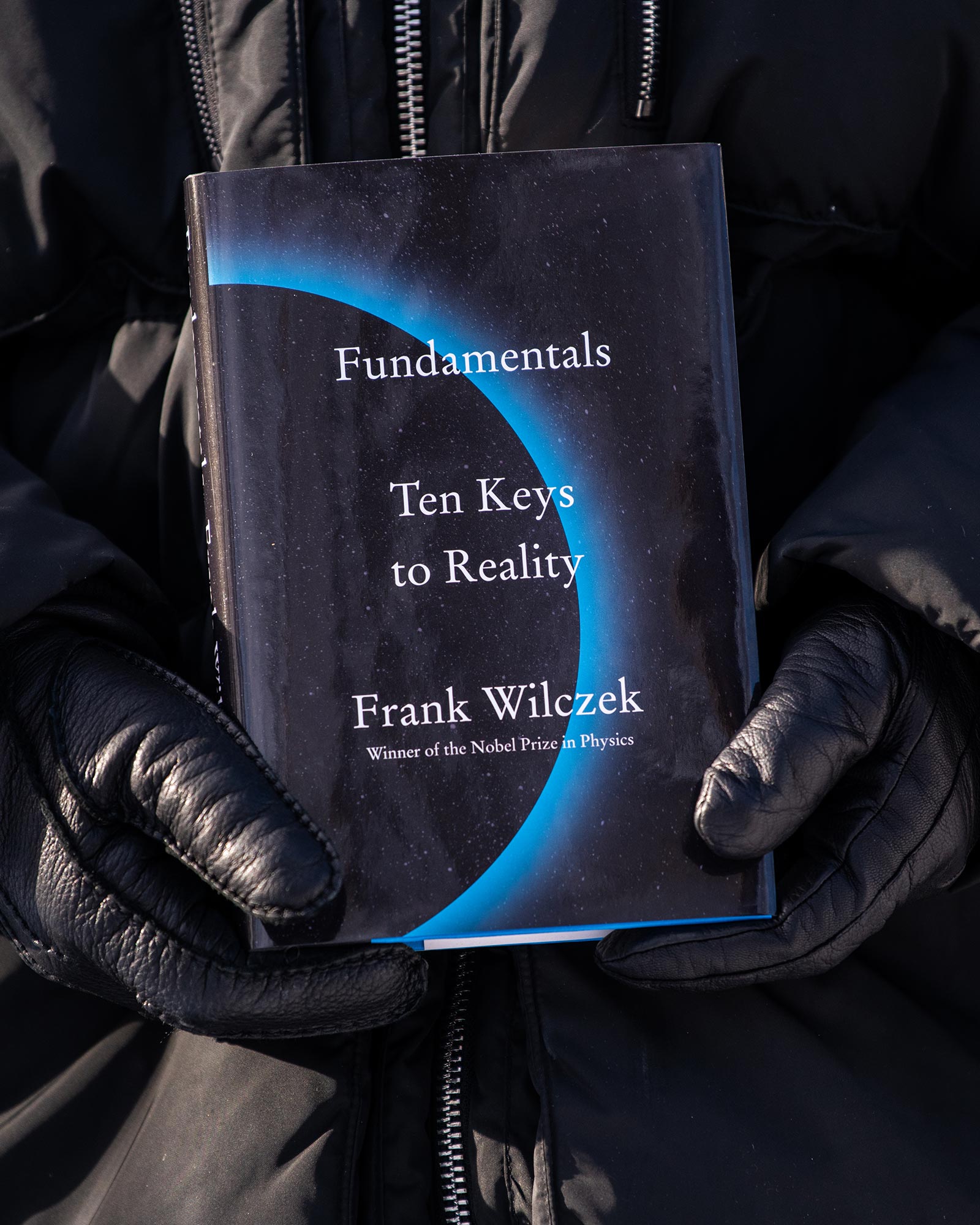 Frank Wilczek holding his new book Fundamental.