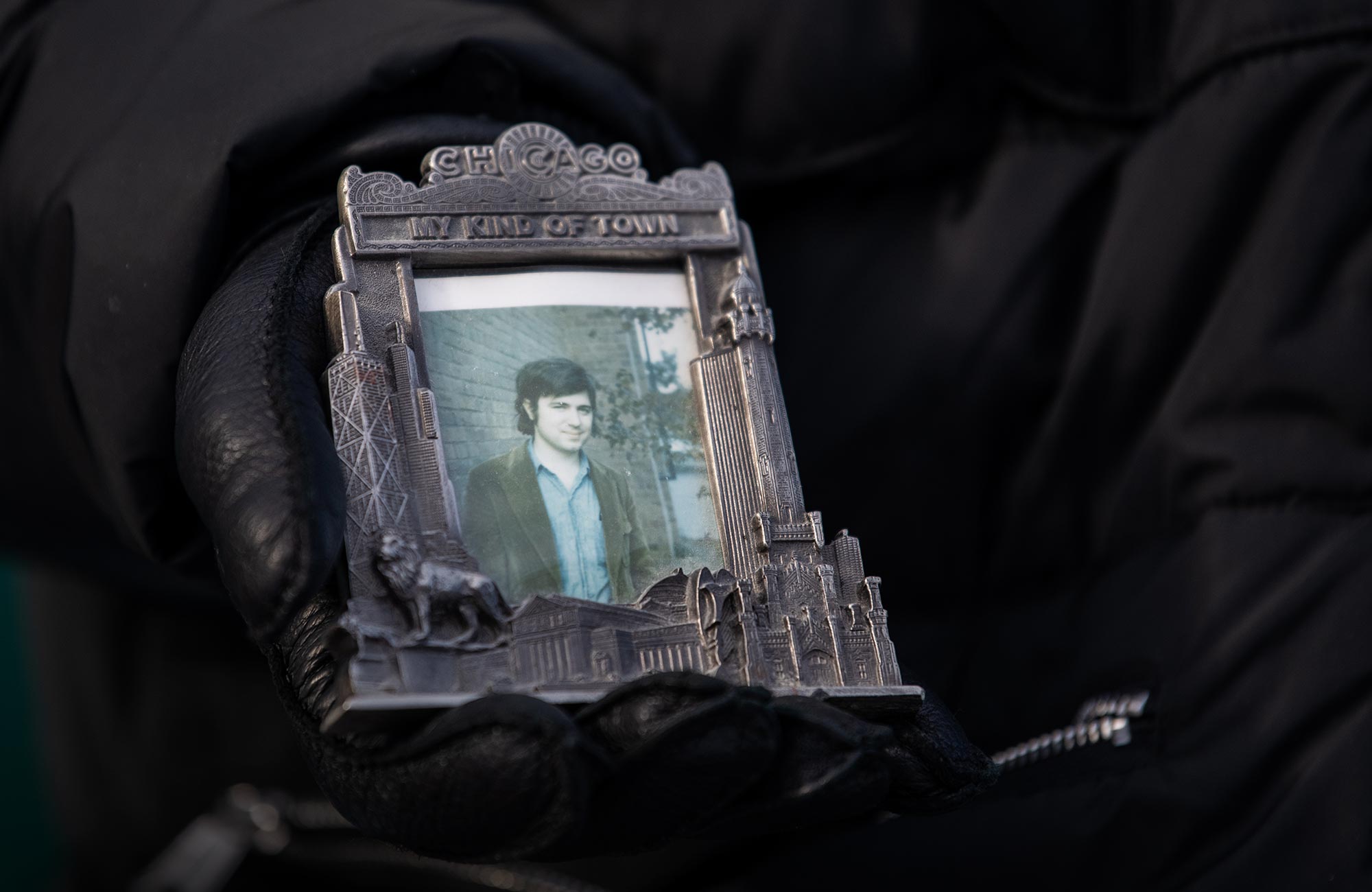 Wilczek holding a photo of himself from the early 1970s.