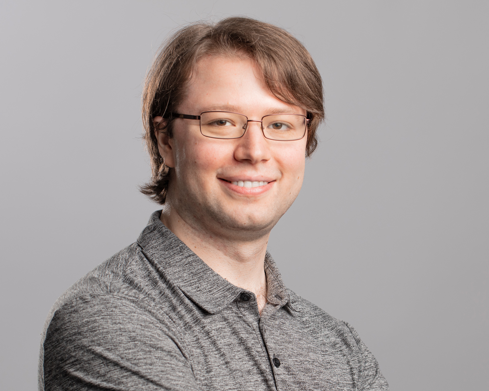 A color photo Virginia Williams in a red shirt in front of a whiteboard, and a color photo of Josh Alman in a gray shirt with a gray background