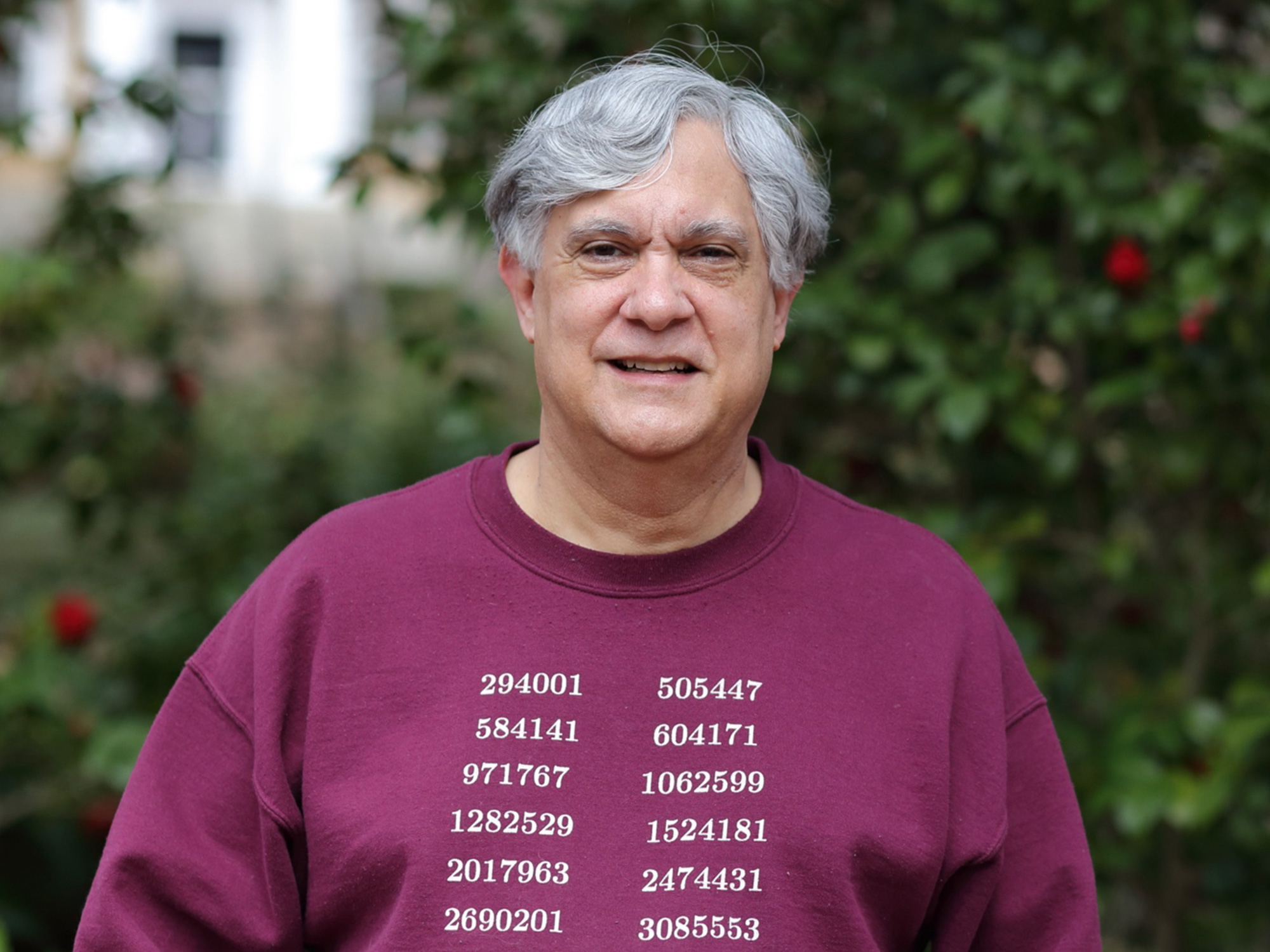 An outdoor photo of Michael Filaseta wearing a sweatshirt with numbers on it