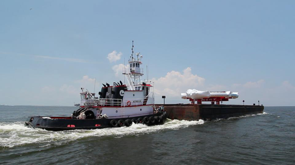 A Barge carrying a large electromagnet