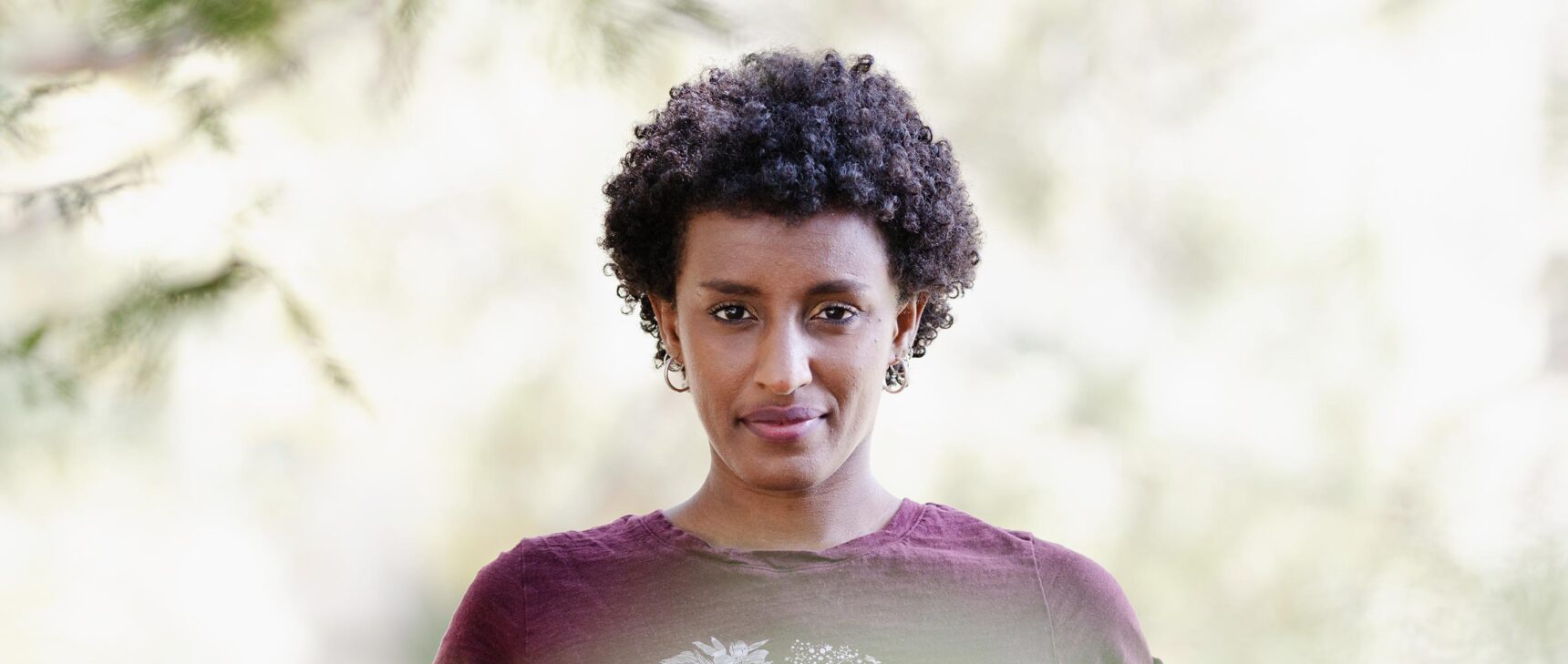 A close-up, head-on portrait of computer scientist Rediet Abebe.