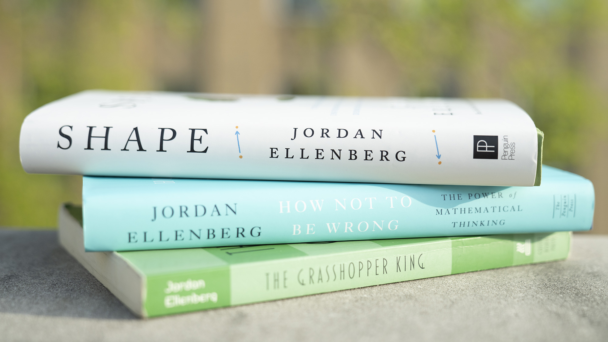 Color photo of a stack of Ellenberg’s three books