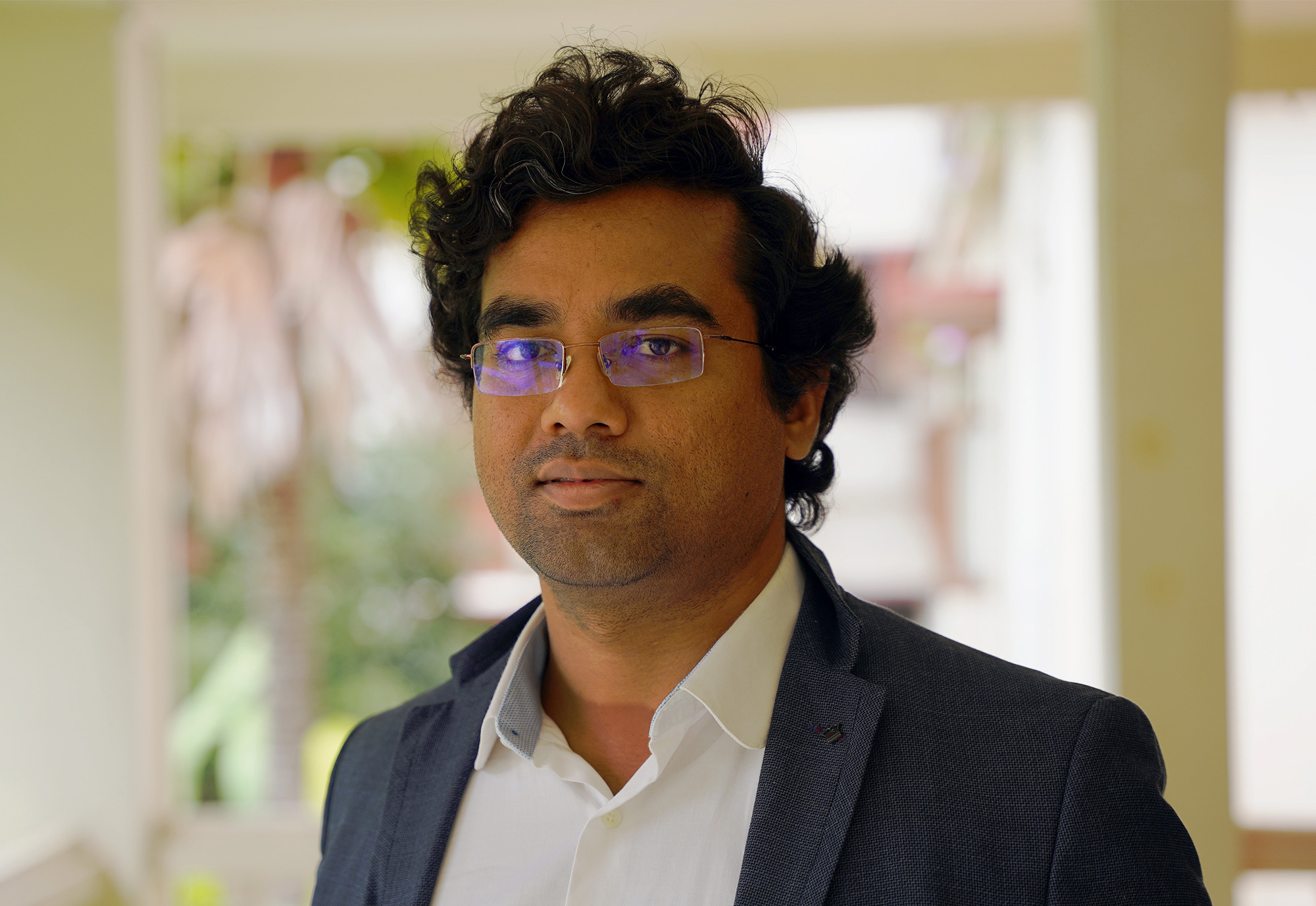 Photo of Mahesh Kakde in a suit jacket indoors