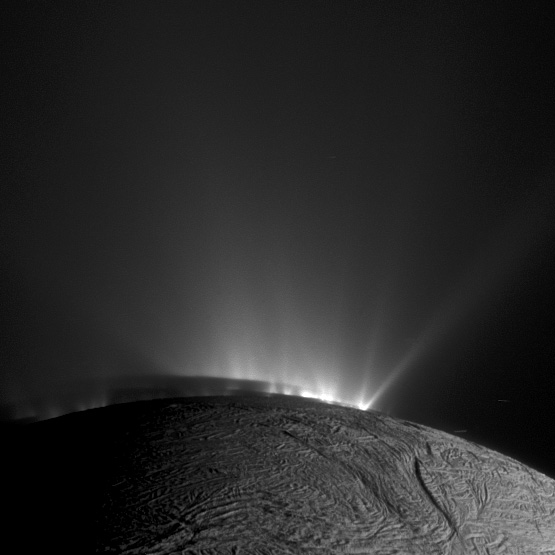 A white moon Enceladus with a geyser.