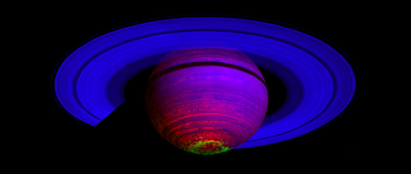 The ringed planet Saturn showing its aurora in green.