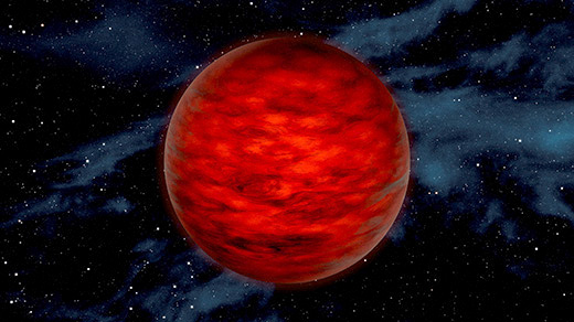 A dark red planetlike object.