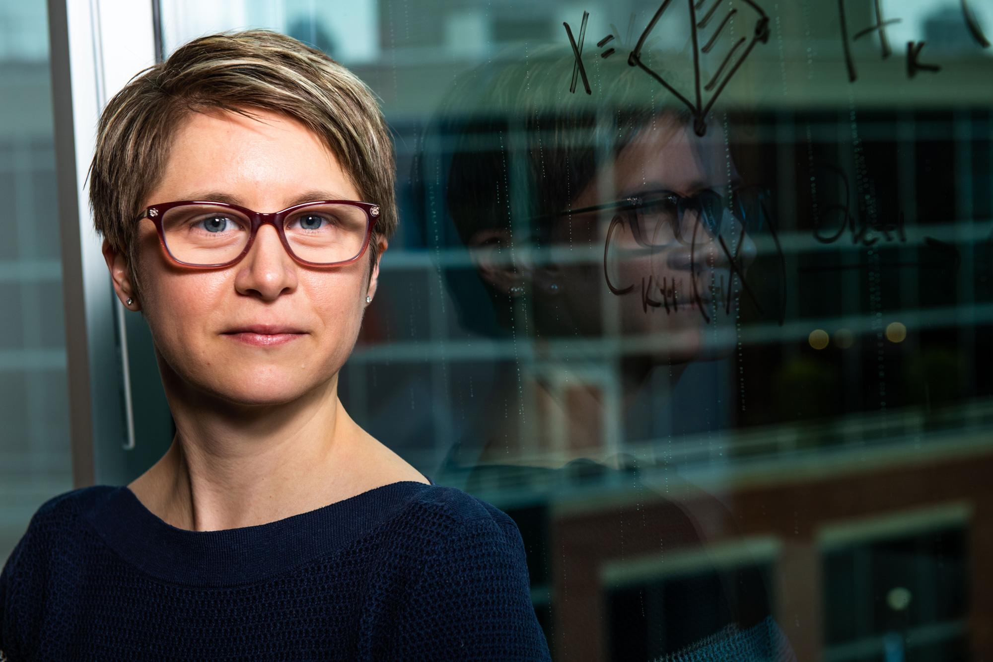 Photo of Emilie Purvine in front of a window