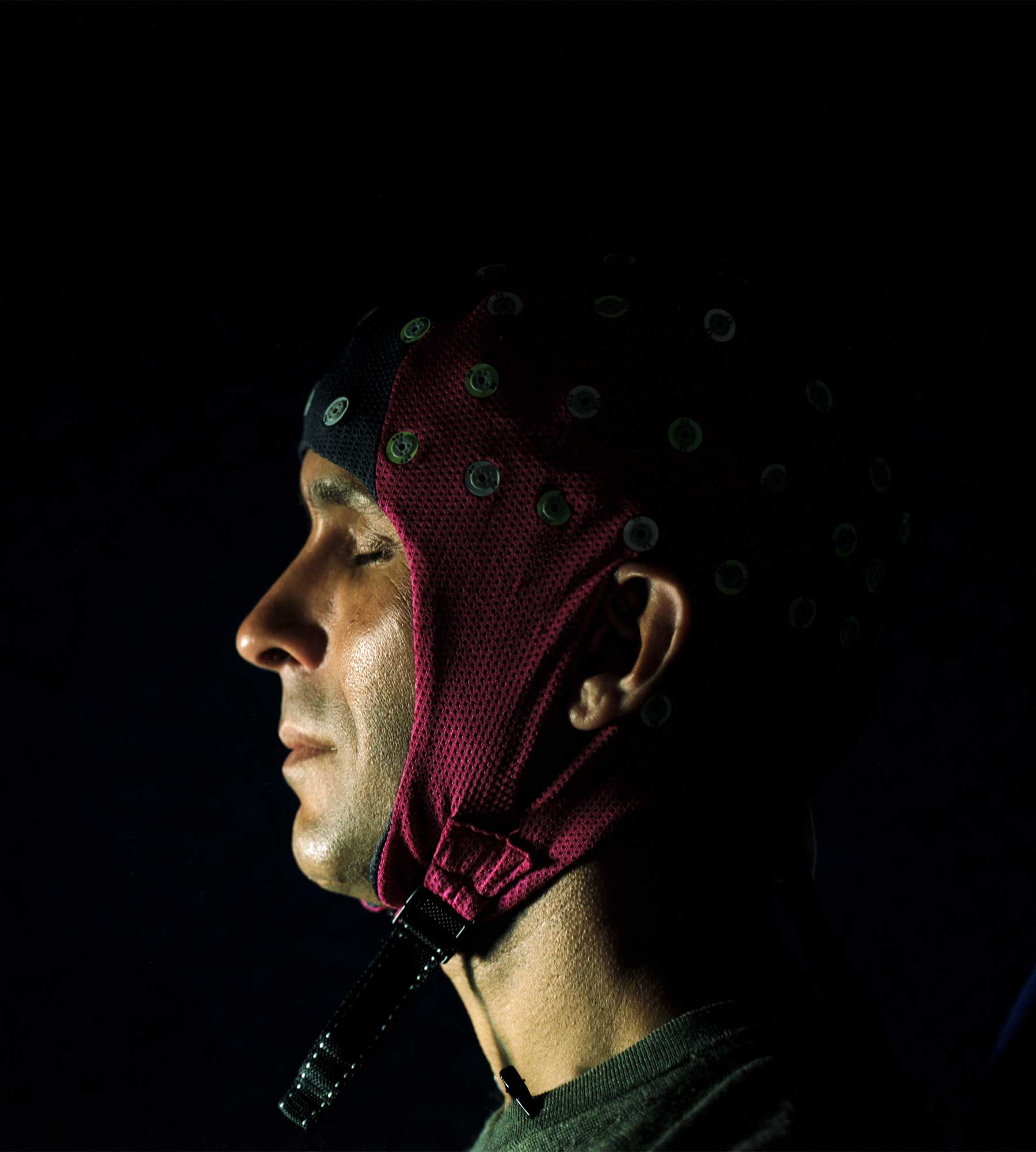 Seth wears a cap covered with sensors for monitoring the brain.