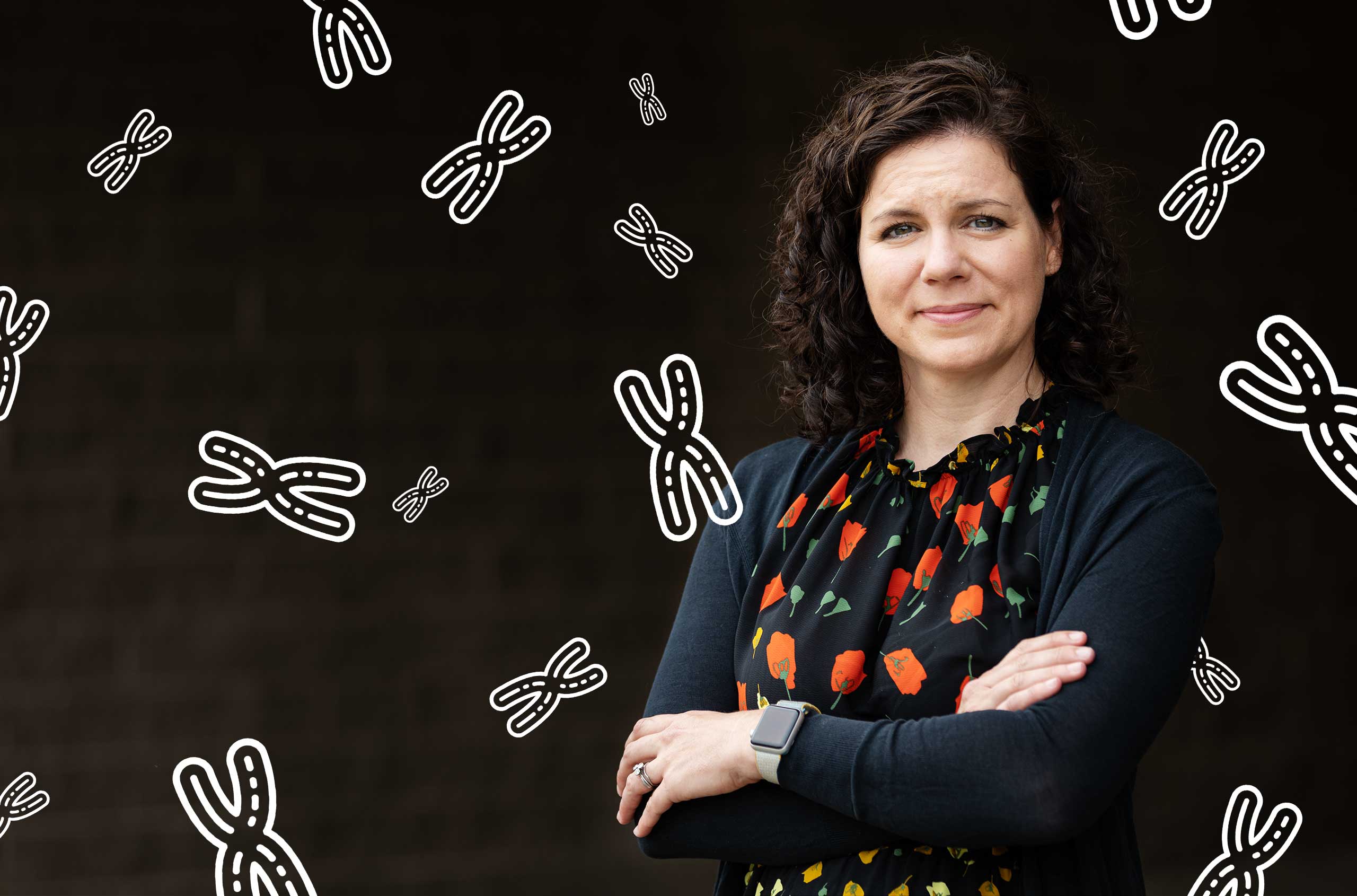 Photo of Karen Miga of the University of California, Santa Cruz, with a representation of chromosomes in the background.