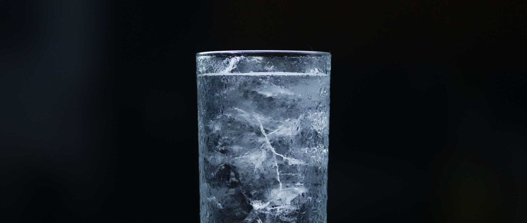 A GIF of ice melting in a glass of water