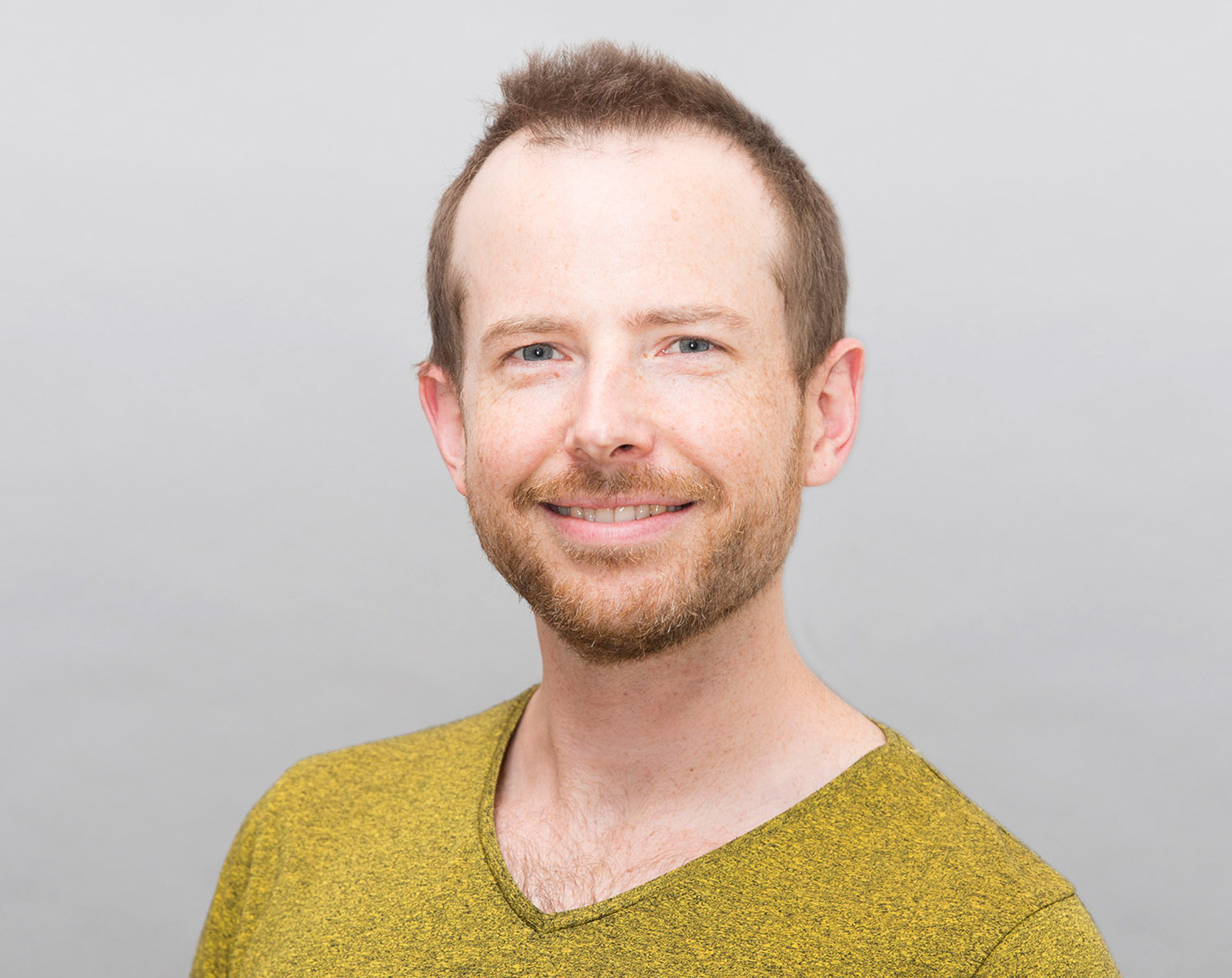 A portrait of Blake Richards in a green sweater against a white background; a portrait of Richard Naud in a blue shirt and blazer, at a desk.