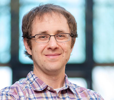 Portrait photos of researchers Tyler Starr and Jesse Bloom of the Fred Hutchison Cancer Research Center.