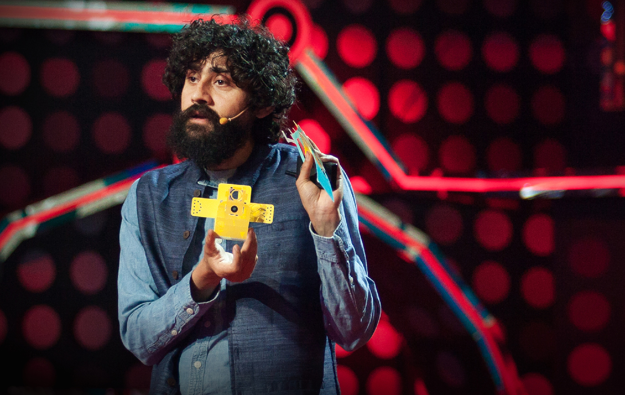 Manu Prakash talking on a TED stage