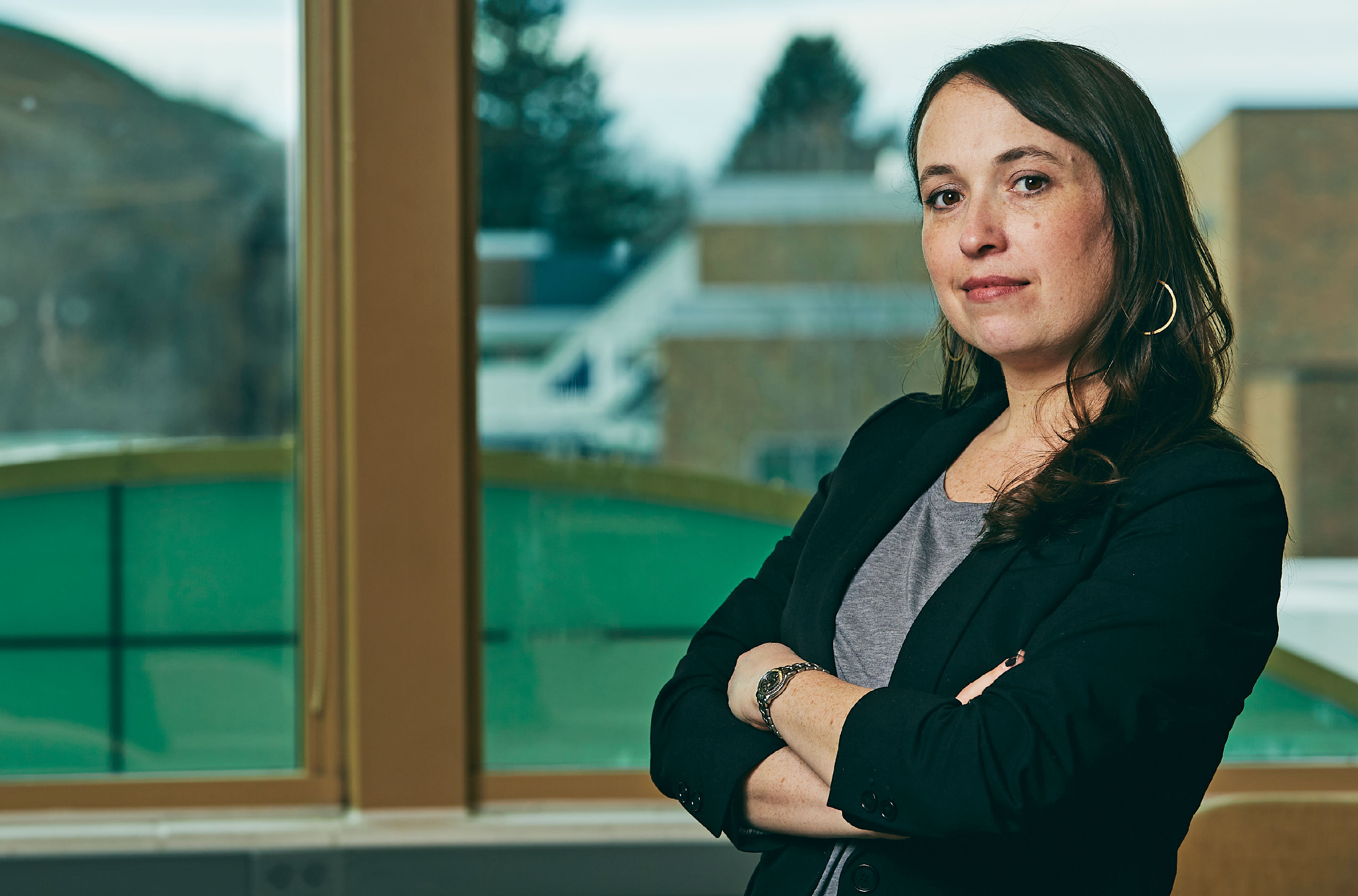 Amy Reines in front of a window.