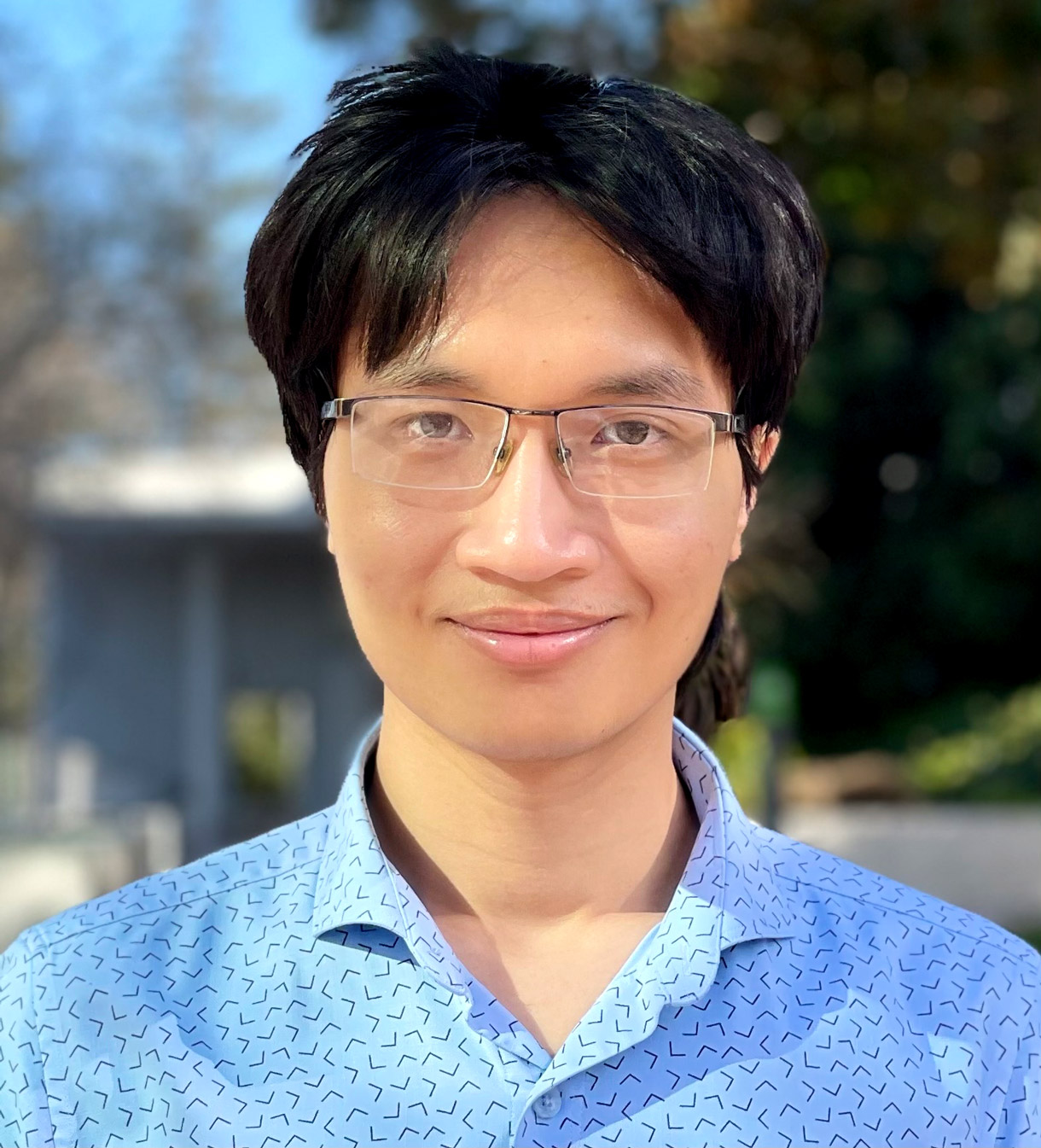 Portrait of Huy Tuan Pham, wearing glasses.