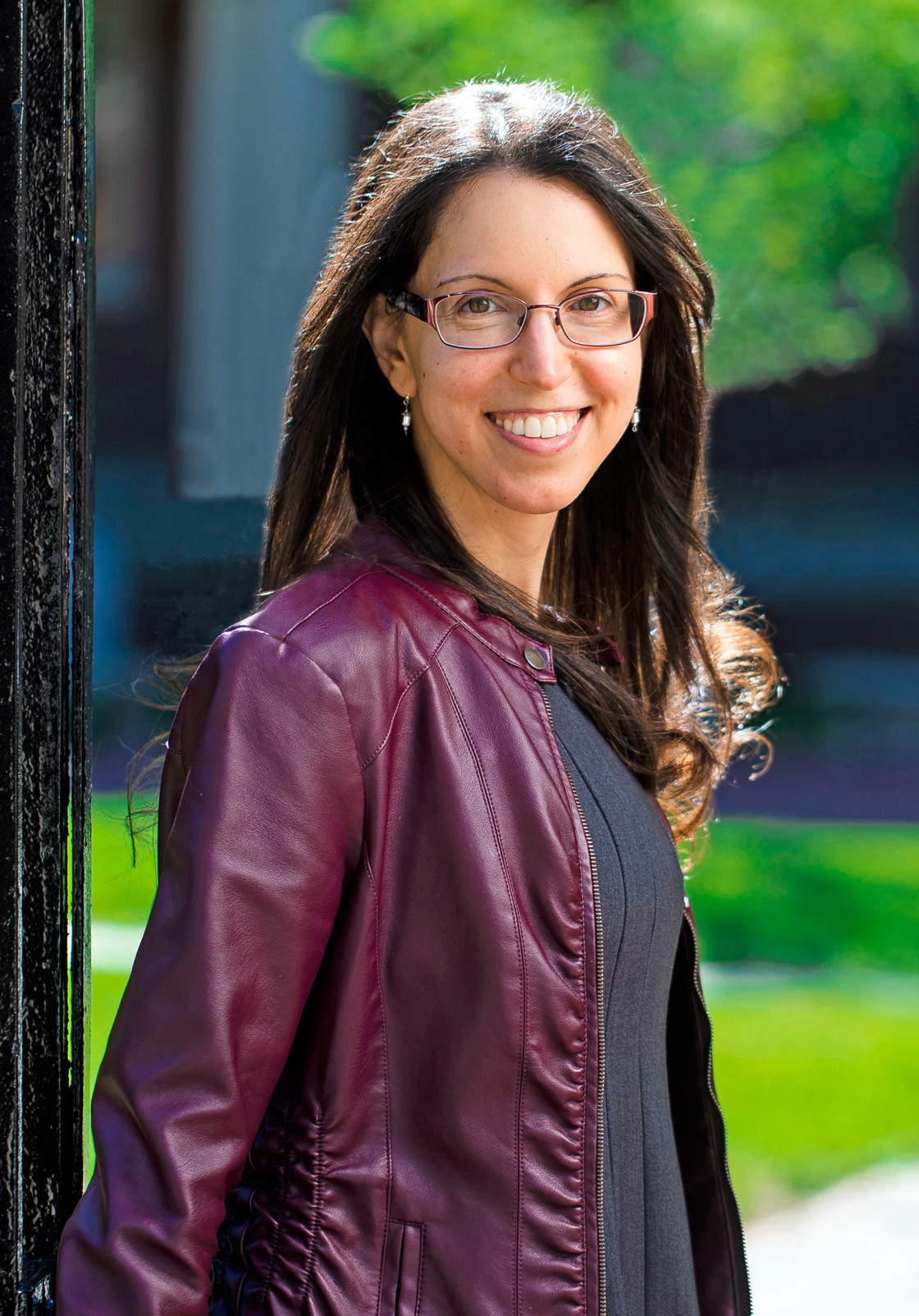 Nicole Yunger Halpern, a woman with dark hair and glasses wearing a purple jacket.