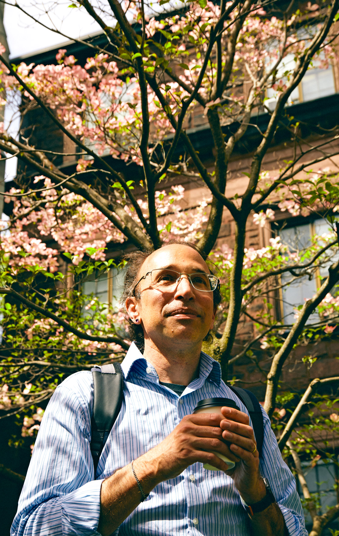 Daniel Spielman stands in front of a tree