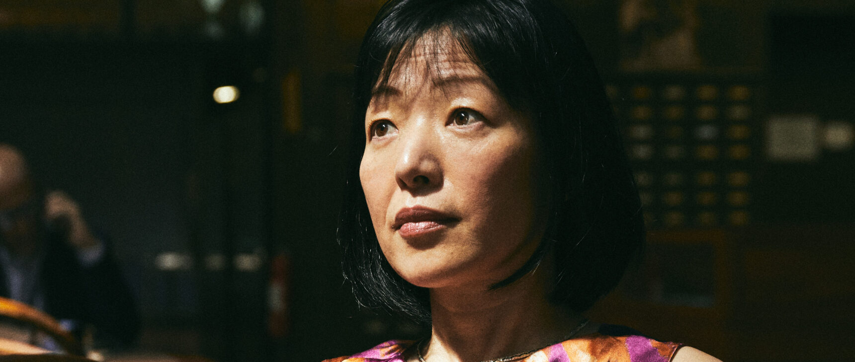 Closeup of Akiko Iwasaki of the Yale School of Medicine against a dark background.