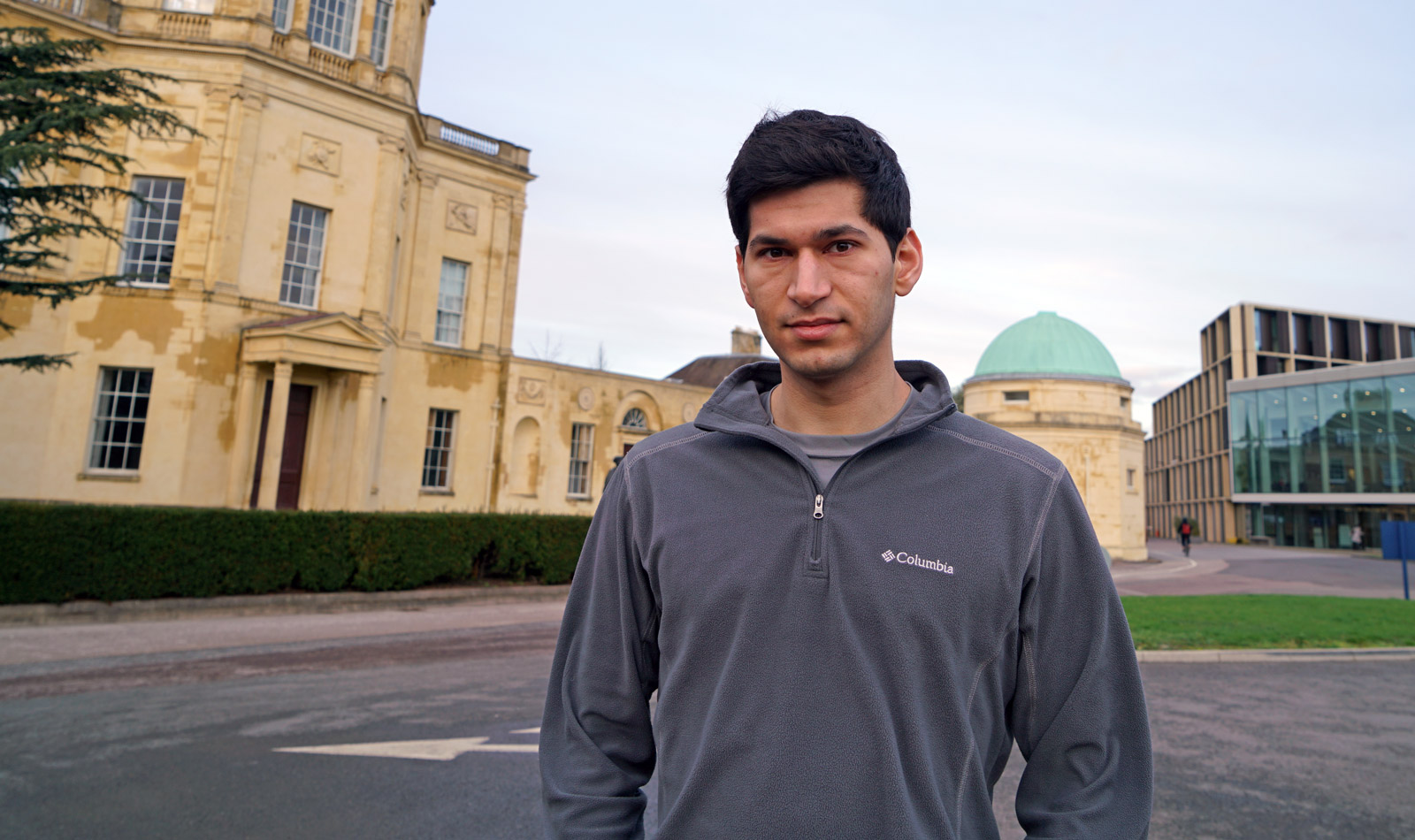 A dark-haired man in a fleece jacket.