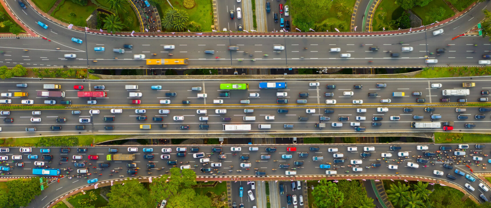 Aerial view of a complicated interchange full of flowing traffic