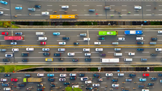 Aerial view of a complicated interchange full of flowing traffic