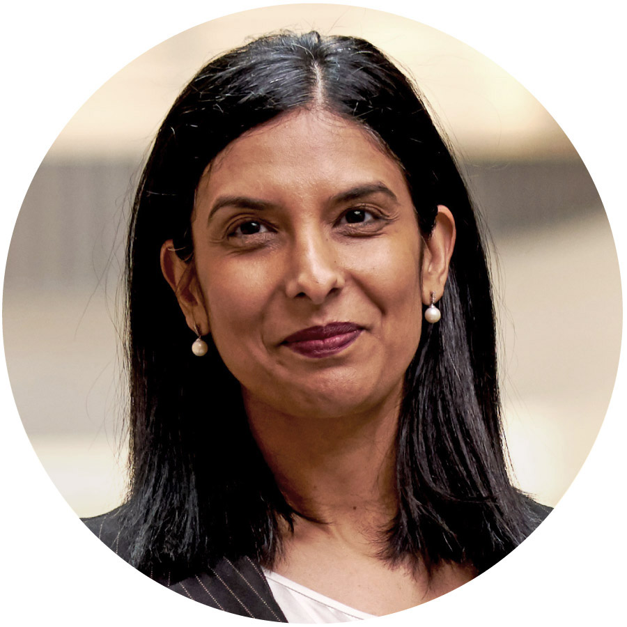 a portrait of a woman with straight dark hair and medium-dark brown skin