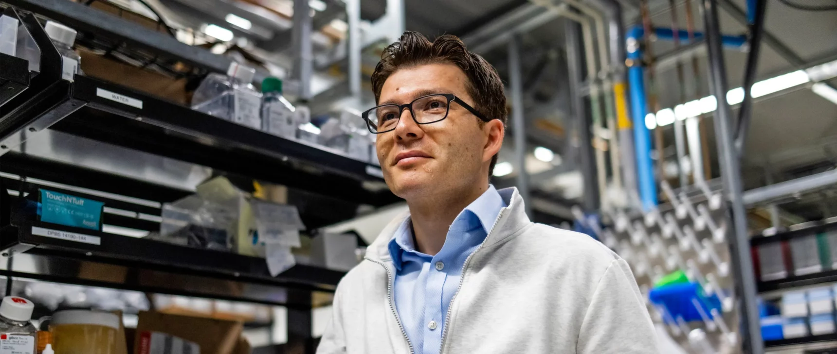 Sergiu Paşca in his lab at Stanford University, in front of a rack of equipment.