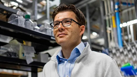 Sergiu Paşca in his lab at Stanford University, in front of a rack of equipment.