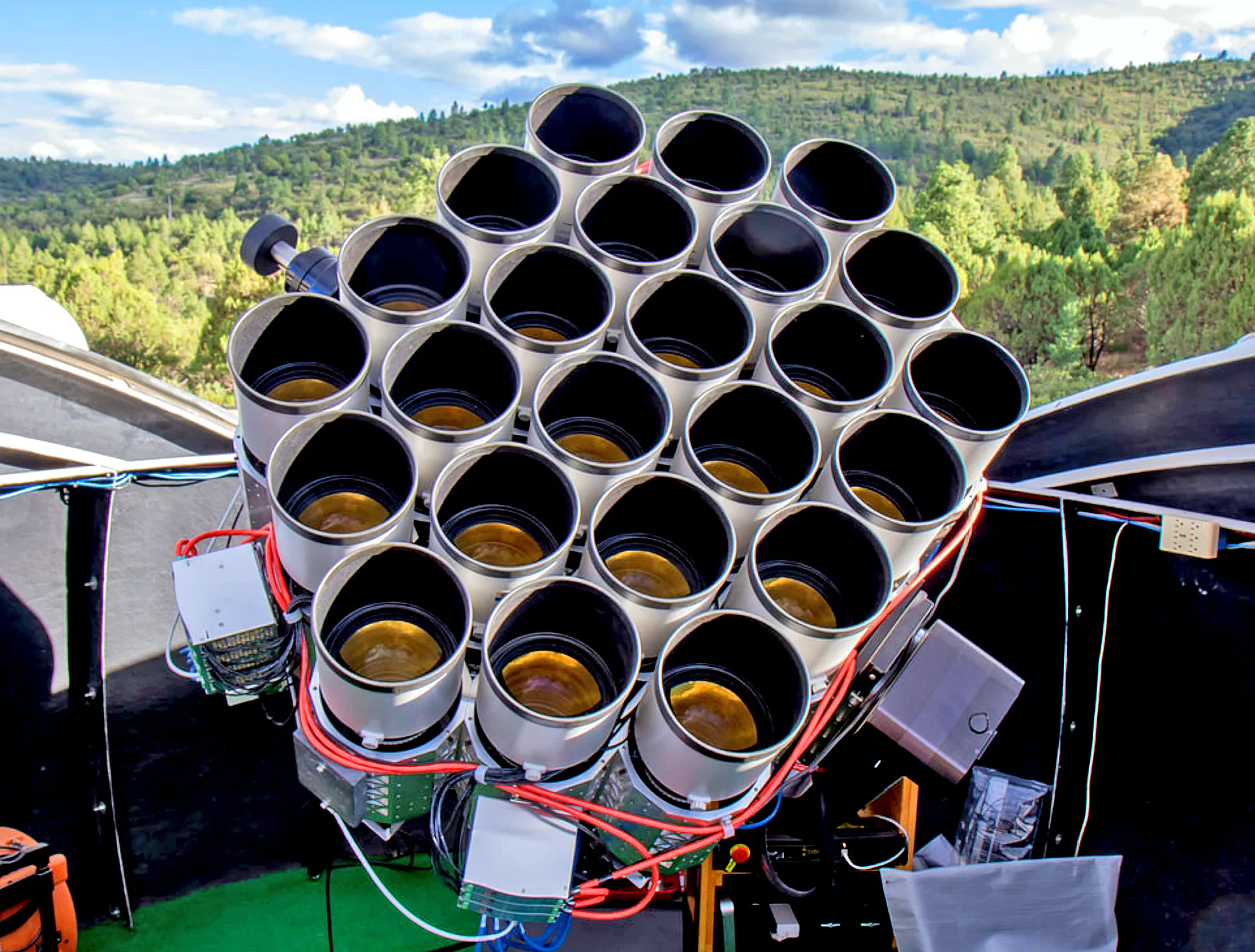 an array of telephoto lenses pointing up toward the sky