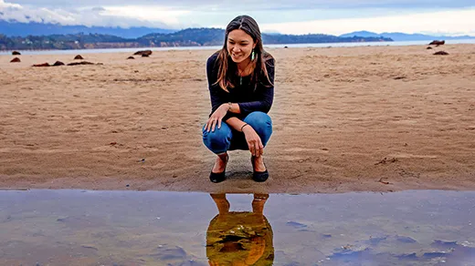 Holly Moeller walks along Campus Point Beach.