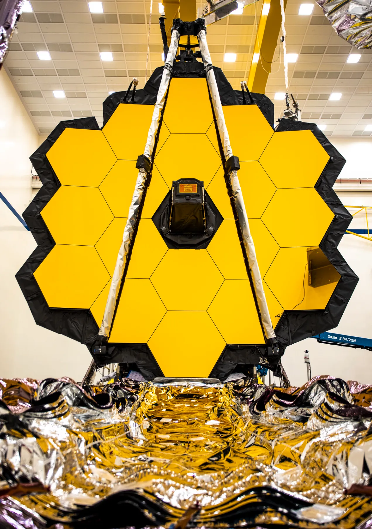 The golden mirror of the James Webb Space Telescope, photographed in a cleanroom.